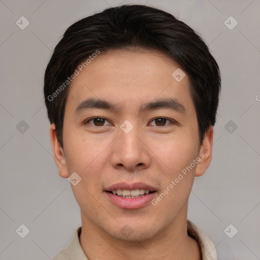 Joyful asian young-adult male with short  brown hair and brown eyes