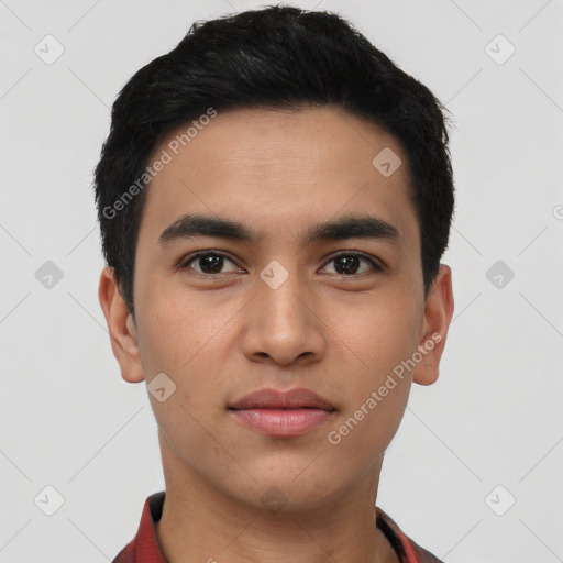 Joyful latino young-adult male with short  black hair and brown eyes