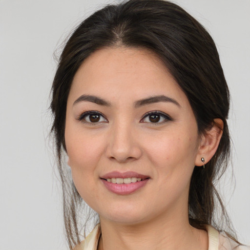 Joyful white young-adult female with medium  brown hair and brown eyes