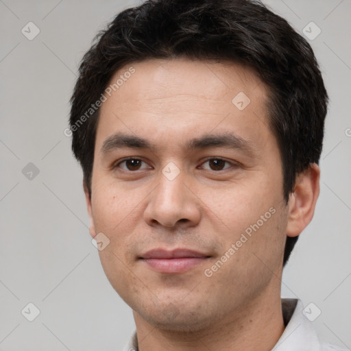 Joyful white young-adult male with short  black hair and brown eyes