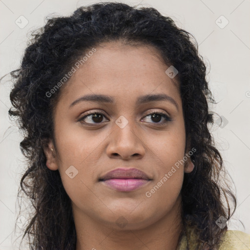 Joyful black young-adult female with long  brown hair and brown eyes