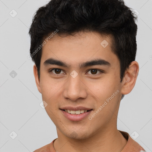 Joyful latino young-adult male with short  brown hair and brown eyes