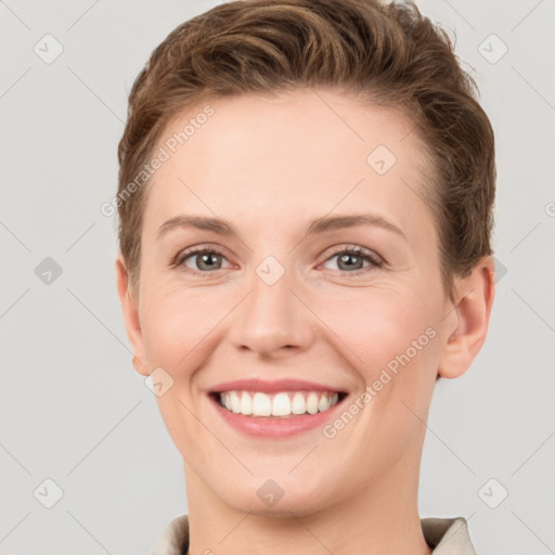 Joyful white young-adult female with short  brown hair and grey eyes