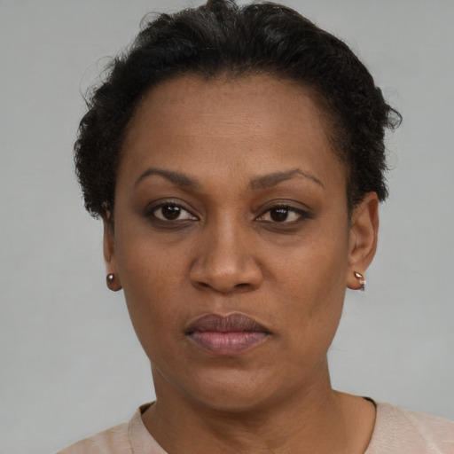 Neutral black adult female with short  brown hair and brown eyes