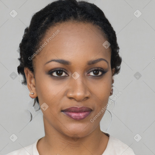 Joyful black young-adult female with short  black hair and brown eyes