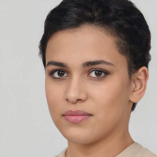 Joyful latino young-adult female with short  brown hair and brown eyes