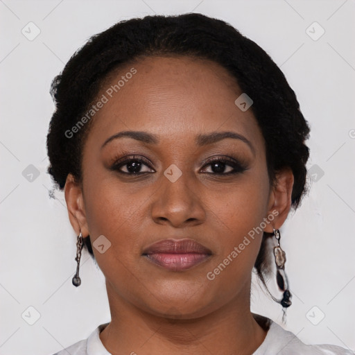 Joyful black young-adult female with short  black hair and brown eyes