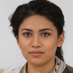 Joyful asian young-adult female with medium  brown hair and brown eyes