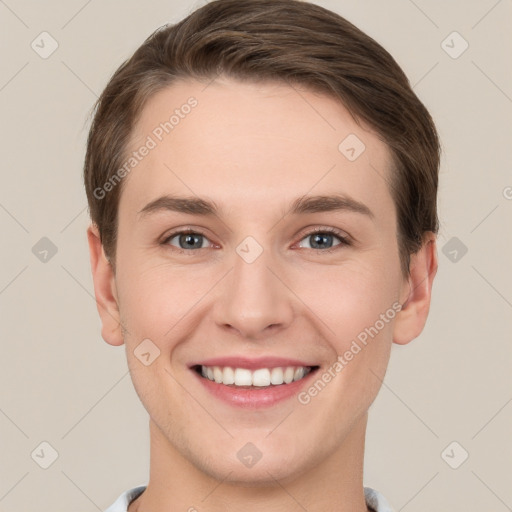 Joyful white young-adult female with short  brown hair and grey eyes