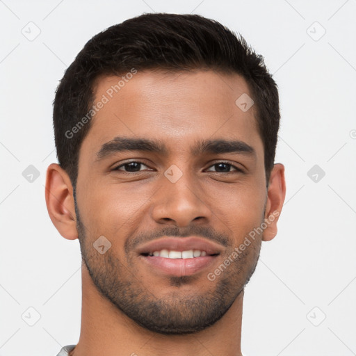 Joyful latino young-adult male with short  brown hair and brown eyes