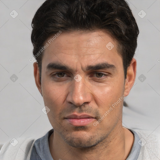 Neutral white adult male with short  black hair and brown eyes