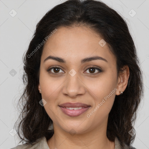 Joyful latino young-adult female with long  brown hair and brown eyes