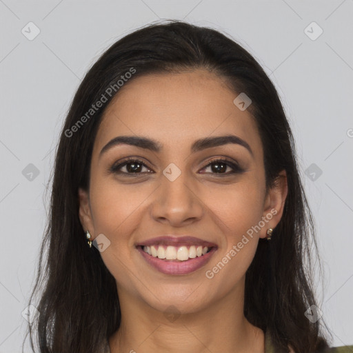 Joyful latino young-adult female with long  brown hair and brown eyes