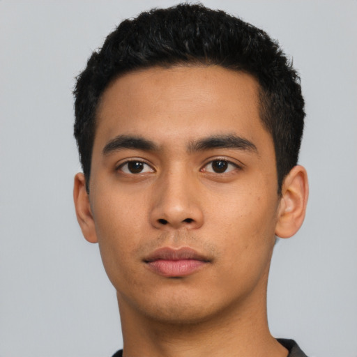 Neutral latino young-adult male with short  black hair and brown eyes