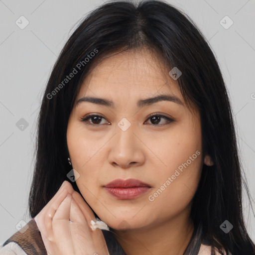 Joyful latino young-adult female with medium  brown hair and brown eyes