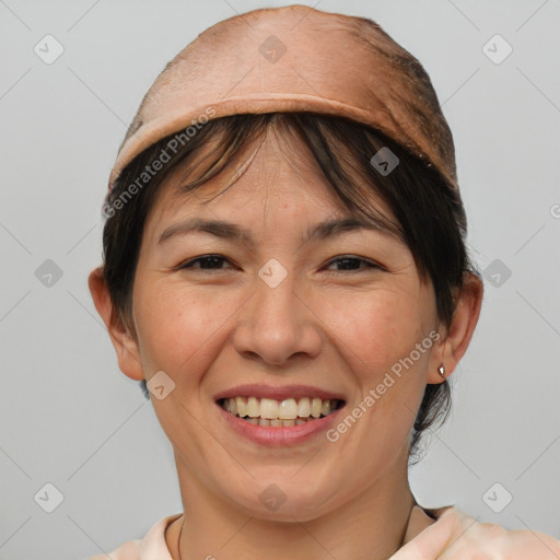 Joyful white adult female with medium  brown hair and brown eyes