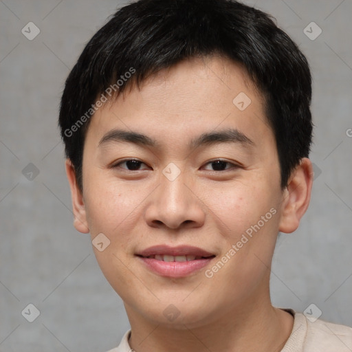 Joyful asian young-adult male with short  black hair and brown eyes