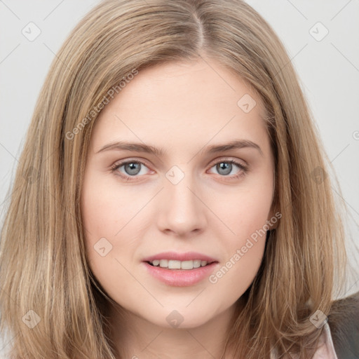 Joyful white young-adult female with long  brown hair and grey eyes