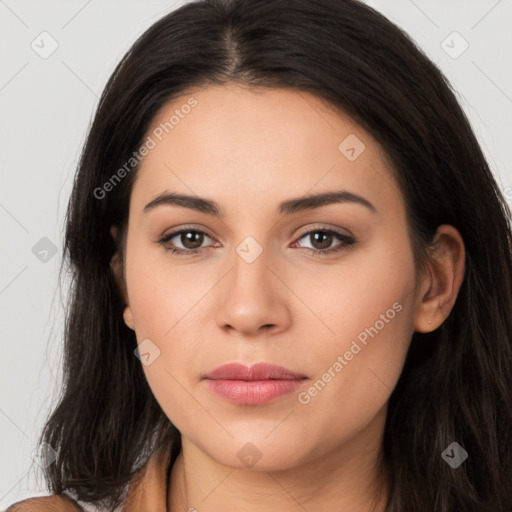 Joyful latino young-adult female with long  brown hair and brown eyes