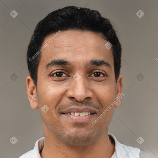 Joyful latino young-adult male with short  brown hair and brown eyes