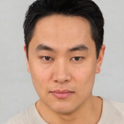 Neutral asian young-adult male with short  brown hair and brown eyes