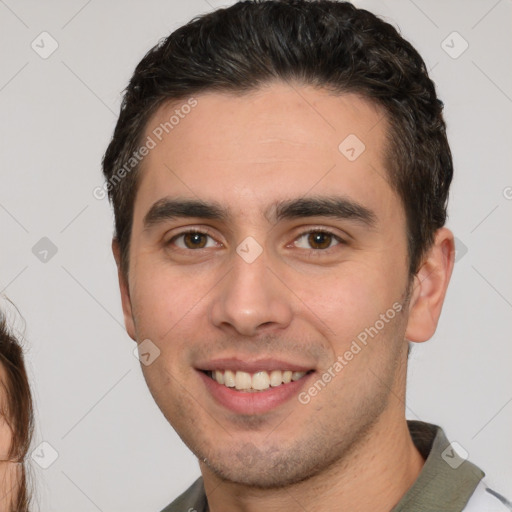 Joyful white young-adult male with short  brown hair and brown eyes