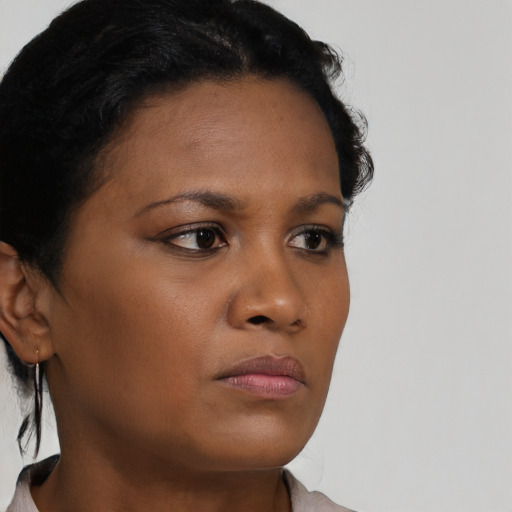 Neutral black young-adult female with short  brown hair and brown eyes