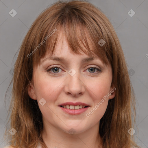 Joyful white young-adult female with medium  brown hair and blue eyes