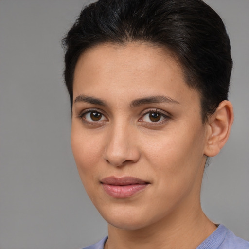 Joyful white young-adult female with short  brown hair and brown eyes