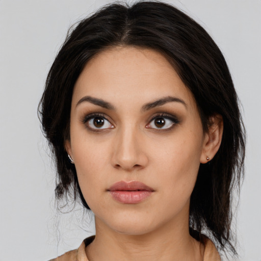 Joyful white young-adult female with medium  black hair and brown eyes