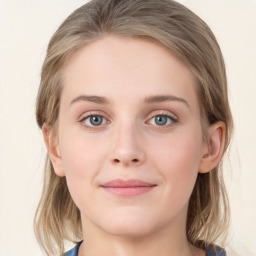 Joyful white young-adult female with medium  brown hair and blue eyes