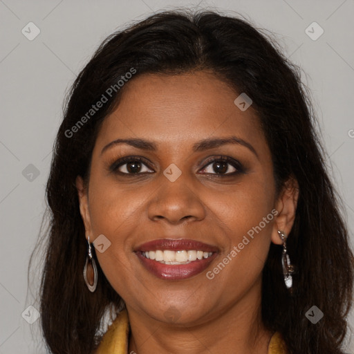 Joyful black young-adult female with long  brown hair and brown eyes