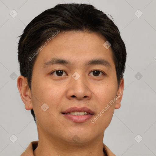 Joyful asian young-adult male with short  brown hair and brown eyes