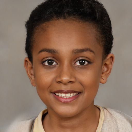 Joyful black child female with short  brown hair and brown eyes