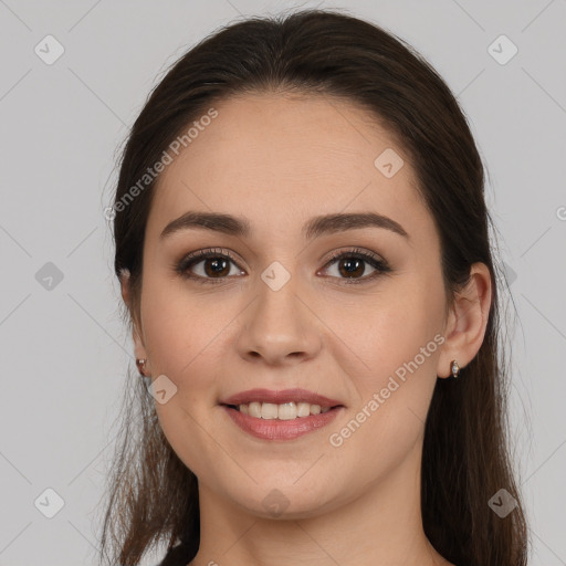 Joyful white young-adult female with long  brown hair and brown eyes