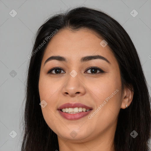 Joyful latino young-adult female with long  black hair and brown eyes