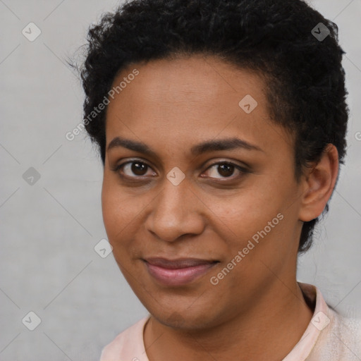 Joyful black young-adult female with short  brown hair and brown eyes