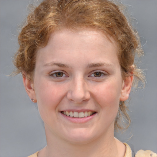 Joyful white young-adult female with medium  brown hair and blue eyes