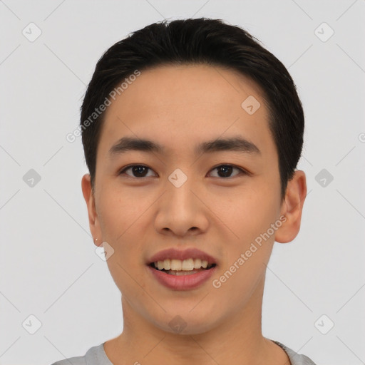 Joyful asian young-adult male with short  black hair and brown eyes