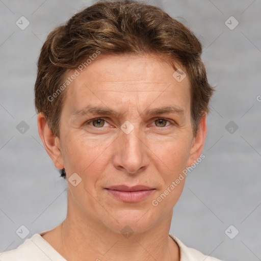 Joyful white adult male with short  brown hair and grey eyes