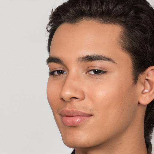 Joyful white young-adult male with medium  brown hair and brown eyes