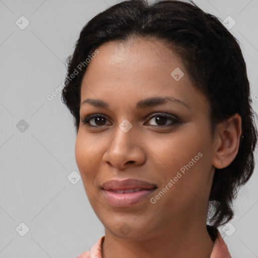 Joyful black young-adult female with medium  brown hair and brown eyes