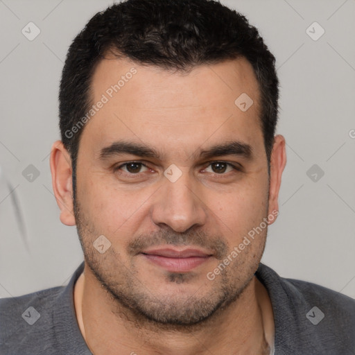 Joyful white young-adult male with short  black hair and brown eyes