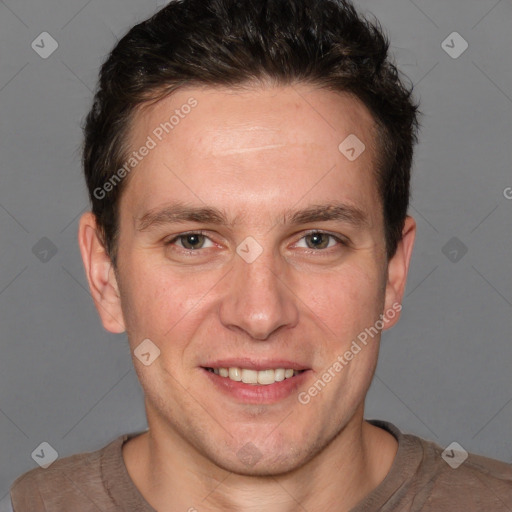 Joyful white adult male with short  brown hair and brown eyes