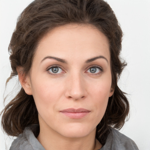 Neutral white young-adult female with medium  brown hair and grey eyes