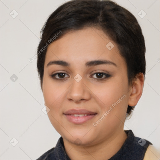 Joyful latino young-adult female with medium  brown hair and brown eyes