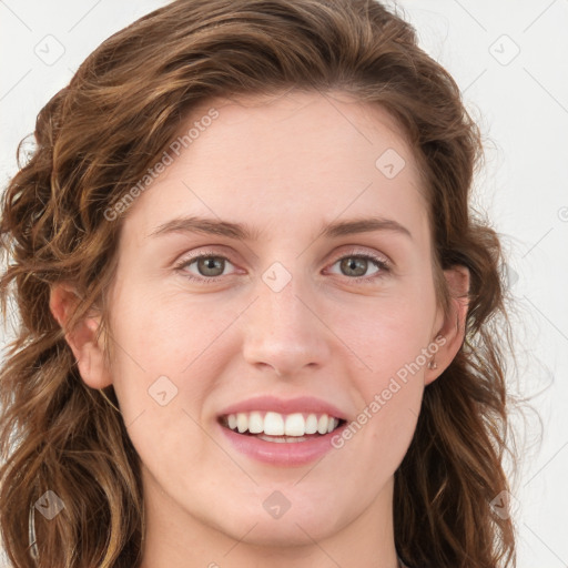 Joyful white young-adult female with long  brown hair and green eyes