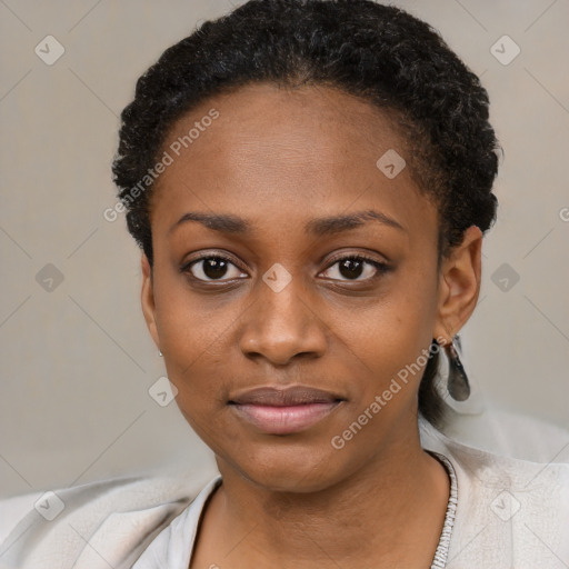 Joyful black young-adult female with short  black hair and brown eyes