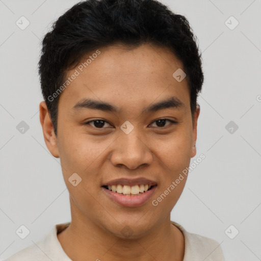 Joyful asian young-adult male with short  black hair and brown eyes