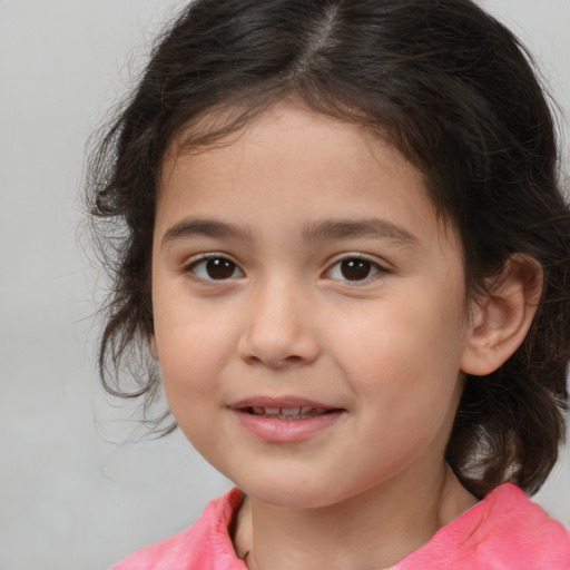 Joyful white child female with medium  brown hair and brown eyes